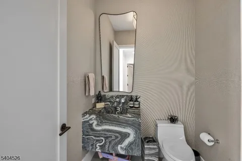 a kitchen with a potted plant on the counter and cabinets