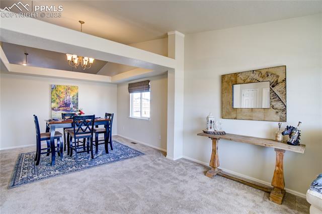 12118 Rio Secco Road Peyton, CO 80831 - Photo 6 of 34 Living room/sitting area to the right as you walk in.