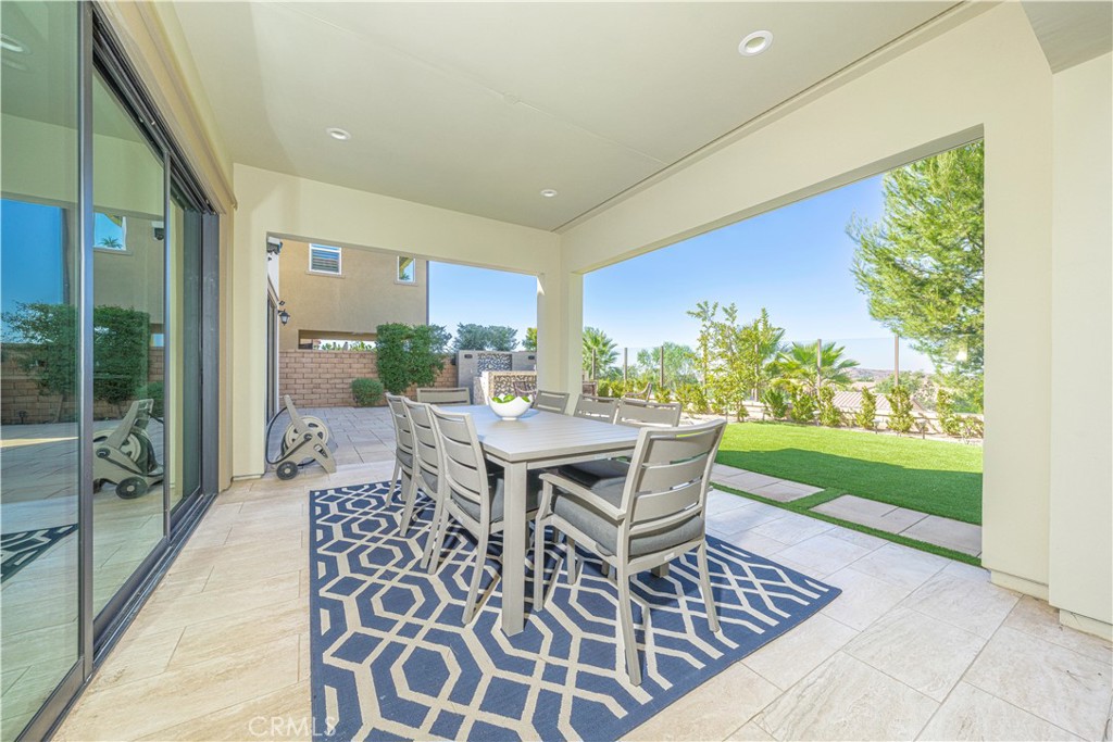 11 Barberry Lake Forest, CA 92630 - Photo 49 of 64 a dining room with furniture and a floor to ceiling window