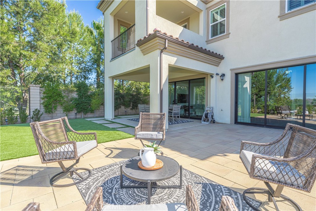 11 Barberry Lake Forest, CA 92630 - Photo 54 of 64 a view of a patio with a dining table and chairs
