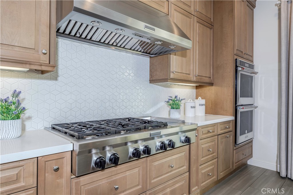 11 Barberry Lake Forest, CA 92630 - Photo 8 of 64 a kitchen with stainless steel appliances granite countertop a stove and a refrigerator