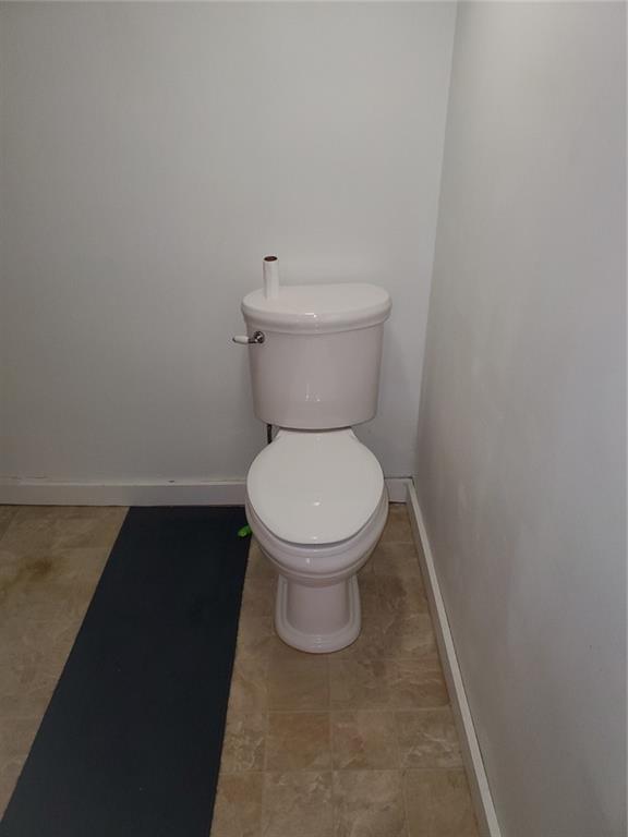 452 Jefferson Street Rochester, PA 15074 - Photo 13 of 18 a white toilet sitting next to a white cabinet