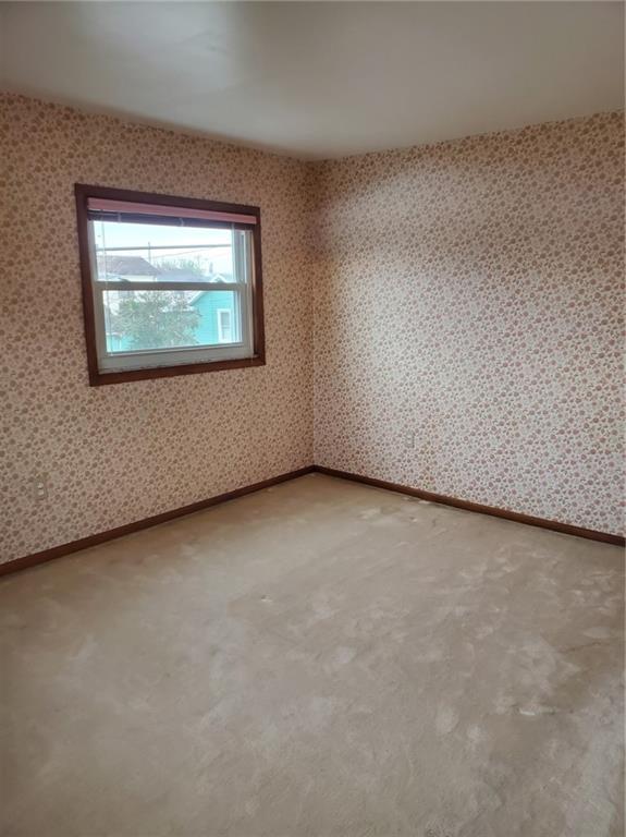 452 Jefferson Street Rochester, PA 15074 - Photo 15 of 18 an empty room with a workbench