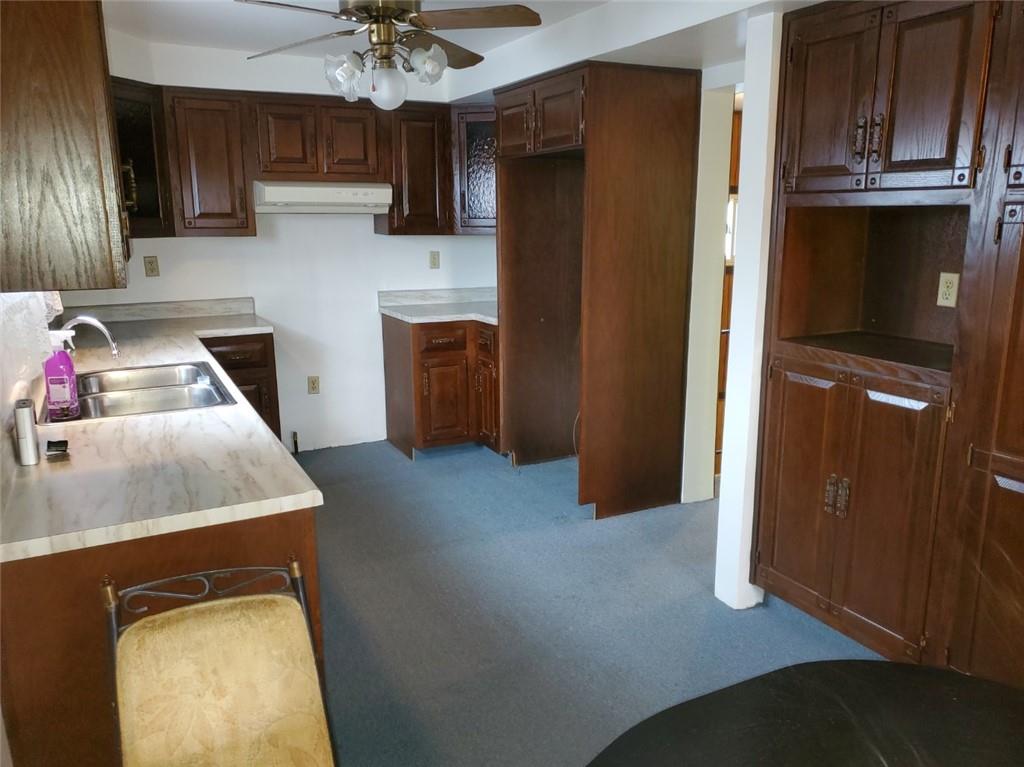 452 Jefferson Street Rochester, PA 15074 - Photo 5 of 18 a kitchen with stainless steel appliances granite countertop a refrigerator a sink dishwasher a stove and a dining table with wooden cabinet