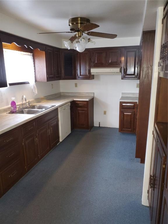 452 Jefferson Street Rochester, PA 15074 - Photo 6 of 18 a kitchen with a sink stove and cabinets