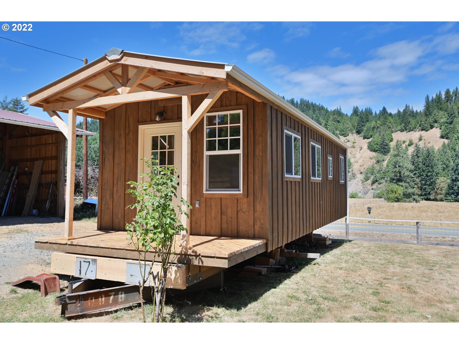 0 Bridge Tiny Home Myrtlepoint Or 97458 Myrtle Point, OR 97458 - Photo 18 of 18 a front view of a house with garden