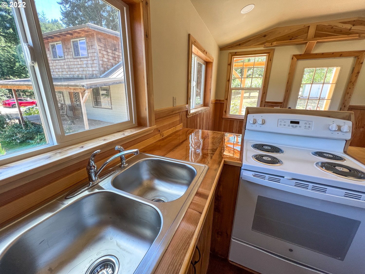 0 Bridge Tiny Home Myrtlepoint Or 97458 Myrtle Point, OR 97458 - Photo 5 of 18 a kitchen with a stove and a sink