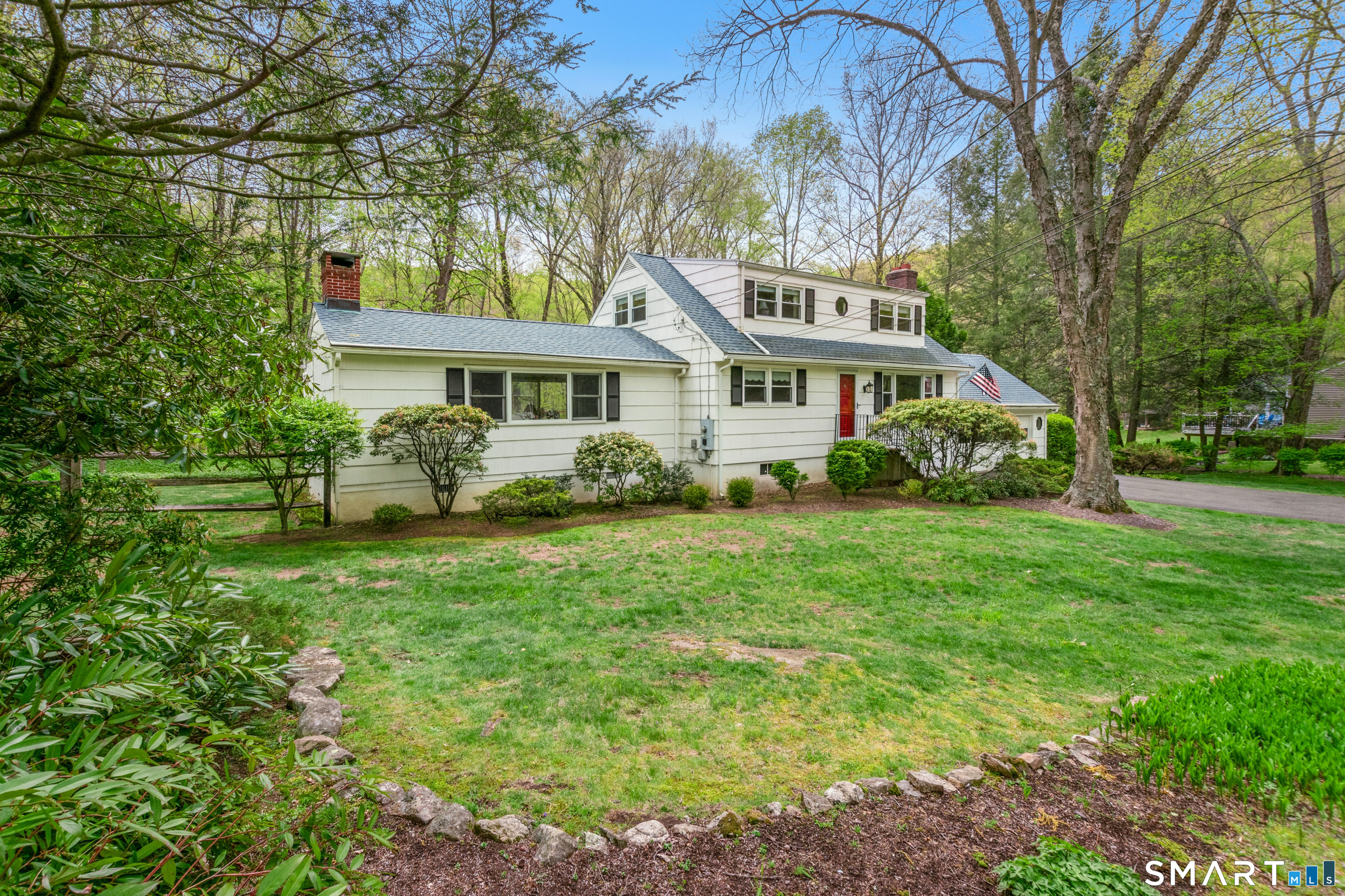 15 Limestone Terrace Ridgefield, CT 06877 - Photo 1 of 32 a front view of a house with a garden