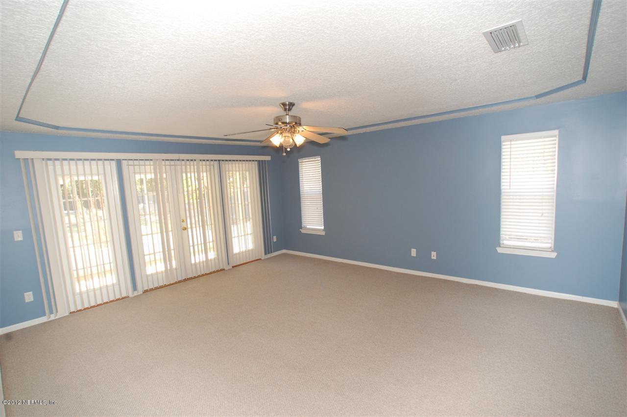 136 Old Hard Road Fleming Island, FL 32003 - Photo 12 of 35 Master Bedroom w/french doors to lanai.