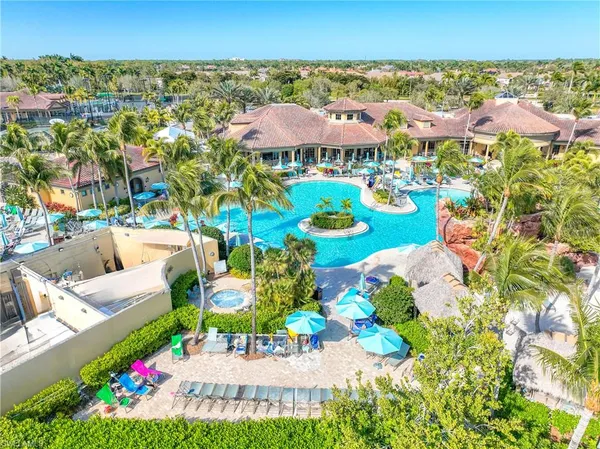 a view of a swimming pool with lounge chair