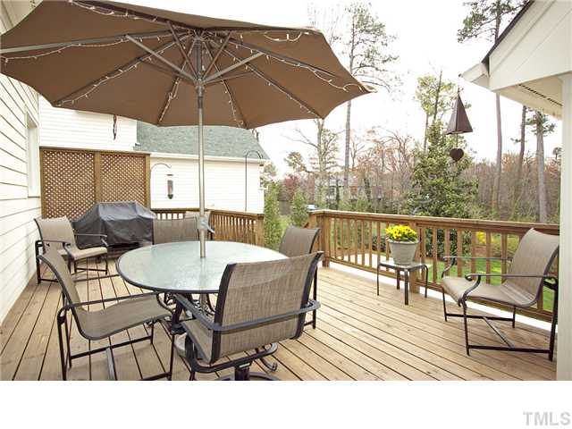 3312 Tall Tree Place Raleigh, NC 27607 - Photo 11 of 12 A wonderful deck provides a place to relax and enjoy the beautiful mature landscaping - specimen magnolias, azaleas, lush grounds, This area is a natural pick for grilling and dining out.