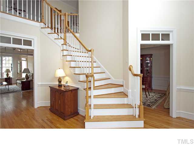 3312 Tall Tree Place Raleigh, NC 27607 - Photo 2 of 12 Two story formal entry with beautiful architectural window and stairway leads into elegant dining room, living room/study, family room, and master bedroom suite.