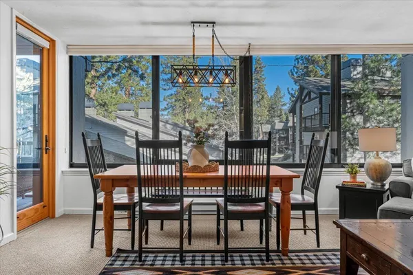 a balcony with furniture and a potted plant