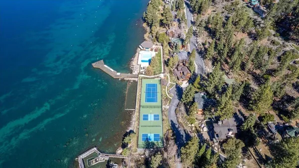 a view of residential houses with outdoor space and lake view