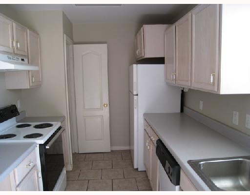 14409 East Cabana Street Corpus Christi, TX 78418 - Photo 3 of 4 a kitchen with a sink a stove and cabinets