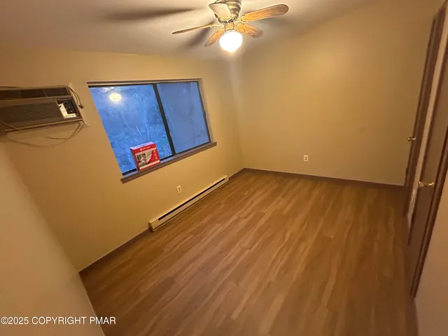 a view of a hallway with a microwave