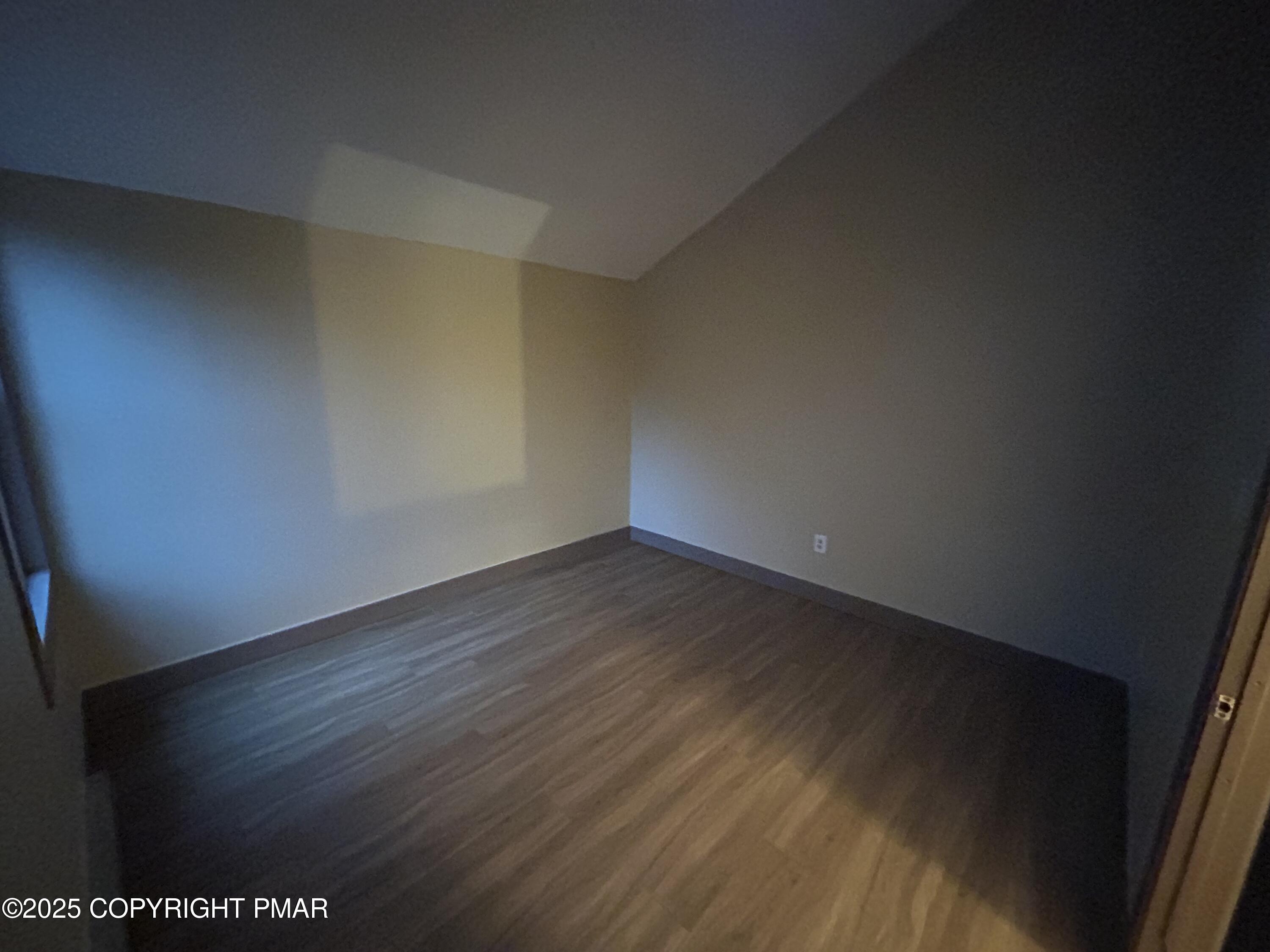 233 Sedburgh Court Bushkill, PA 18324 - Photo 8 of 14 a view of an empty room with wooden floor