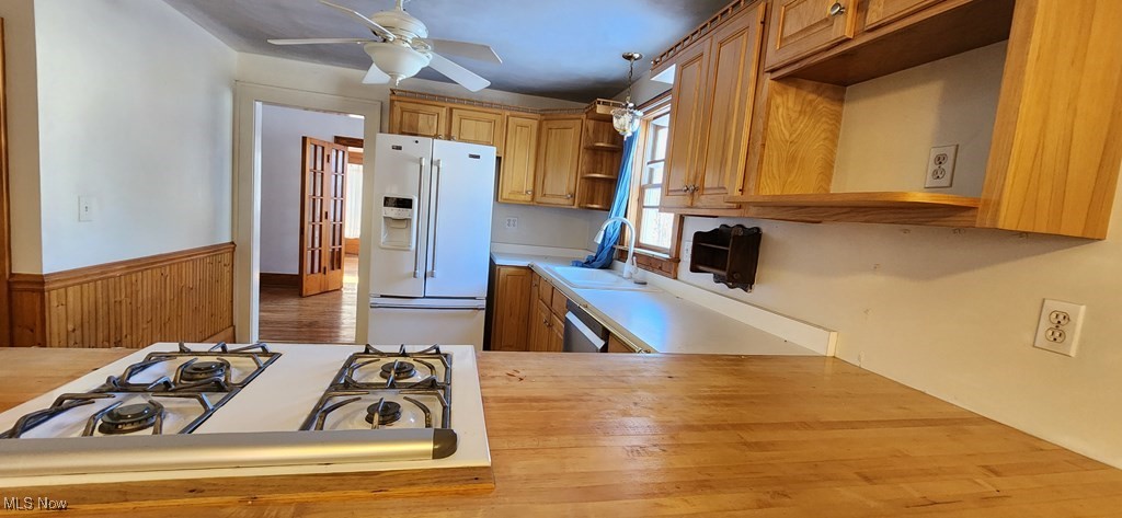 125 Rockdale Road Follansbee, WV 26037 - Photo 2 of 19 Kitchen with white appliances, light countertops, open shelves, a ceiling fan, and wainscoting