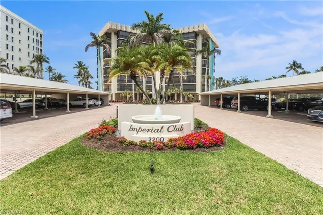 a front view of building with small garden