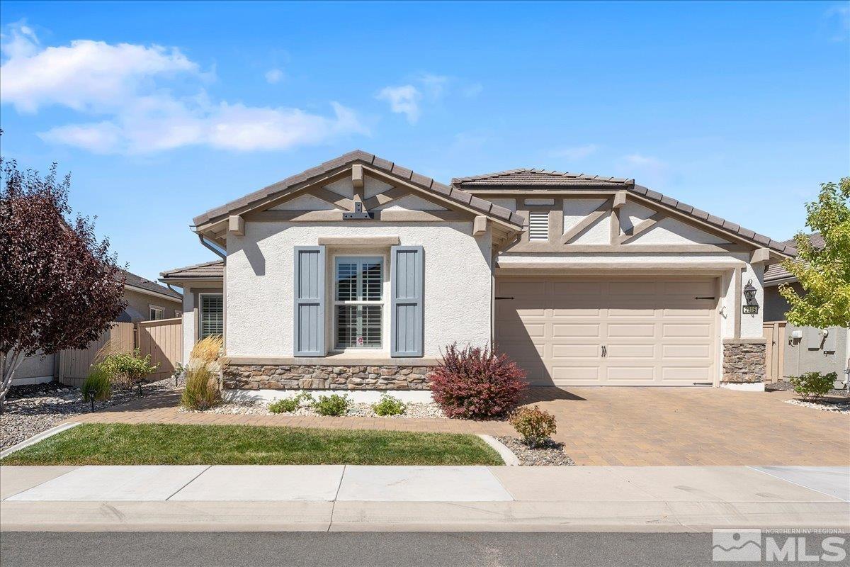 2315 Trakehner Lane Reno, NV 89521 - Photo 1 of 40 a front view of a house with a yard