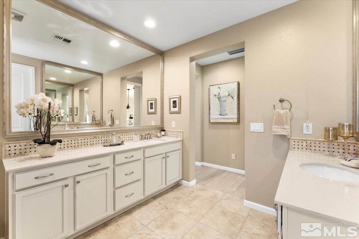 2315 Trakehner Lane Reno, NV 89521 - Photo 18 of 40 a spacious bathroom with a sink a mirror and a shower