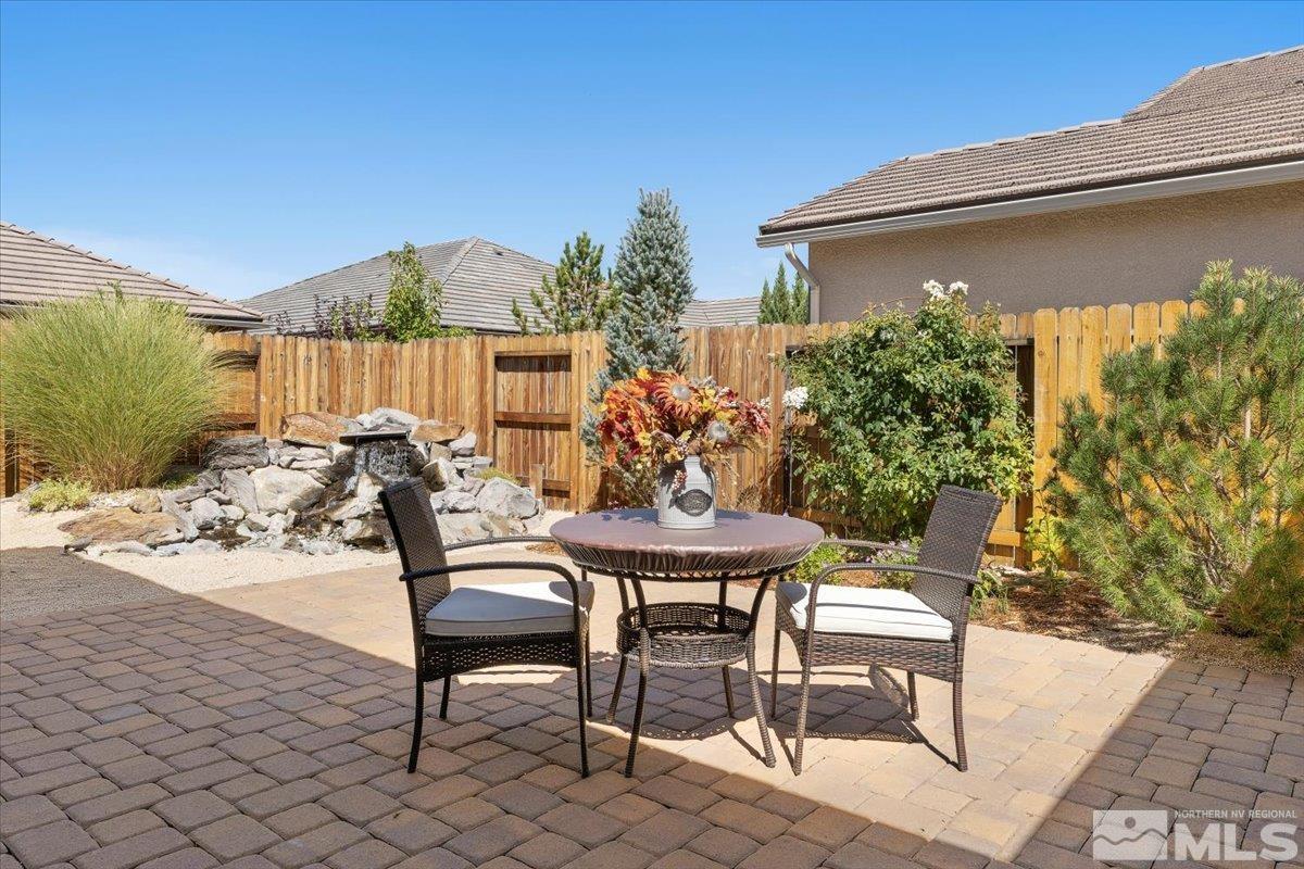 2315 Trakehner Lane Reno, NV 89521 - Photo 25 of 40 a view of a chairs and table in backyard of the house