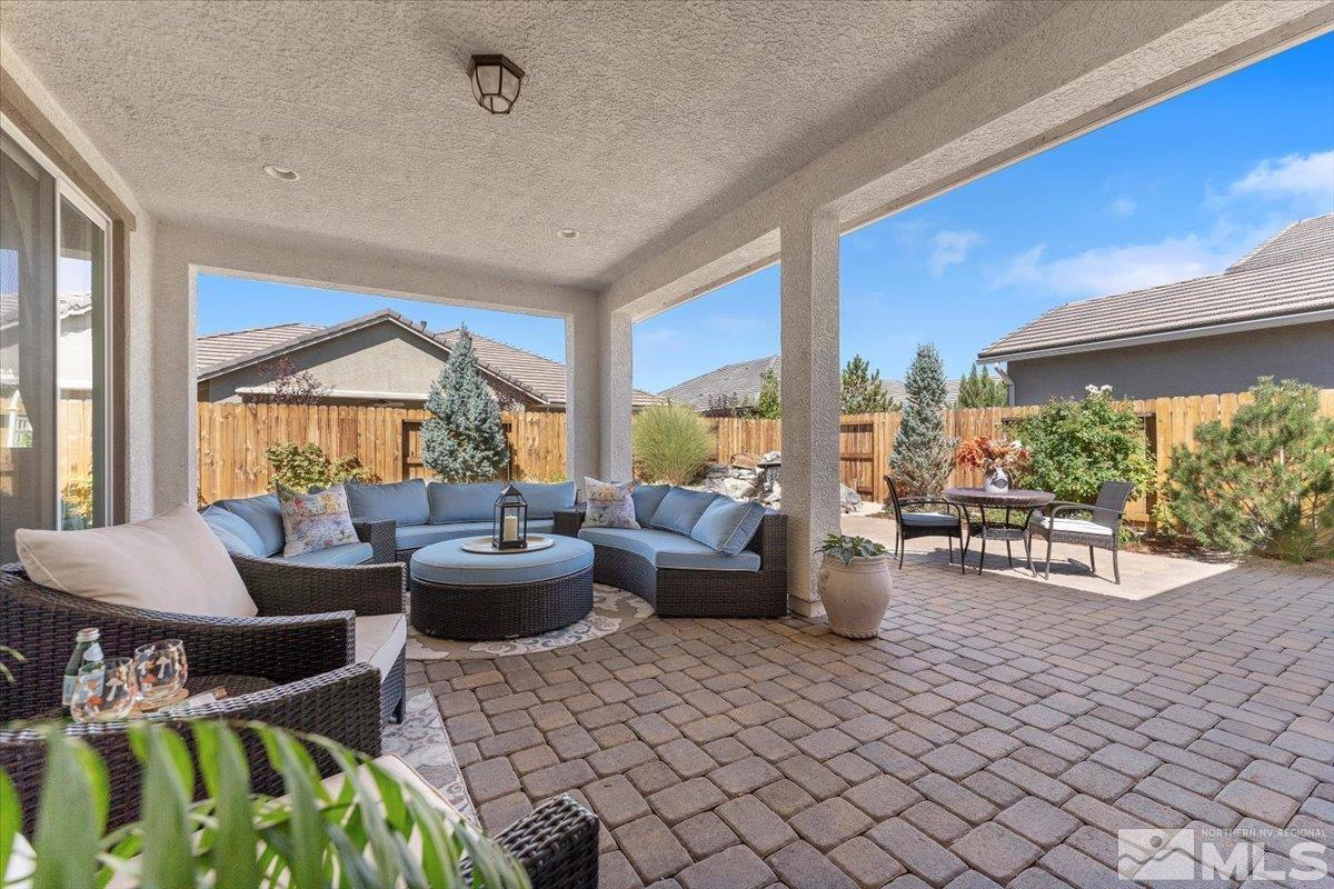 2315 Trakehner Lane Reno, NV 89521 - Photo 29 of 40 a living room with furniture and floor to ceiling windows