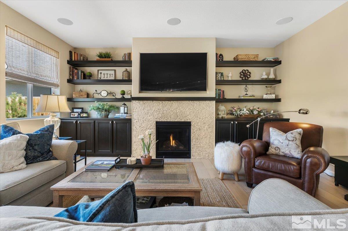 2315 Trakehner Lane Reno, NV 89521 - Photo 9 of 40 a living room with furniture a flat screen tv and a fireplace