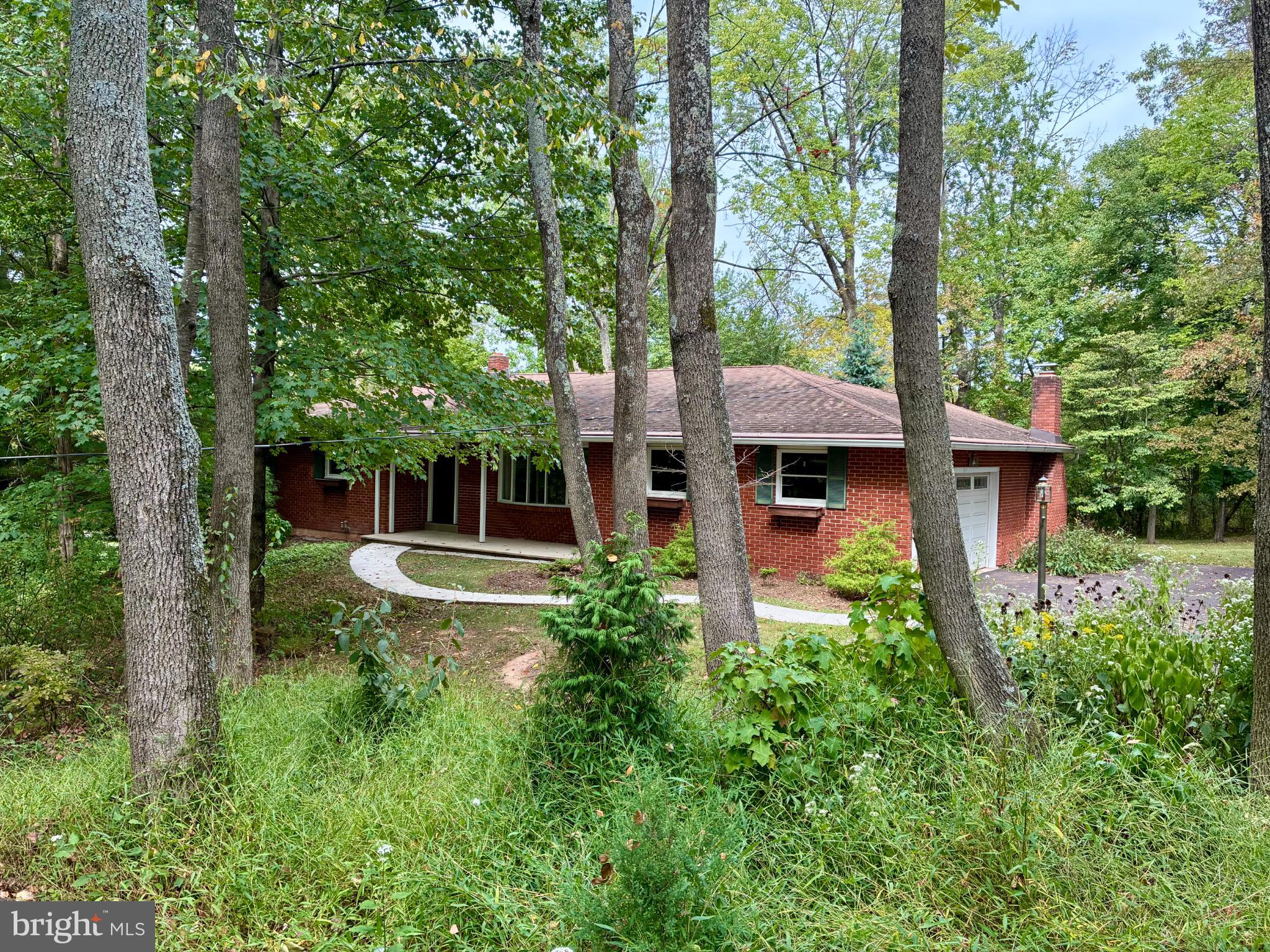 72 Heffner Road Royersford, PA 19468 - Photo 1 of 20 Charming brick home nestled in lush greenery.