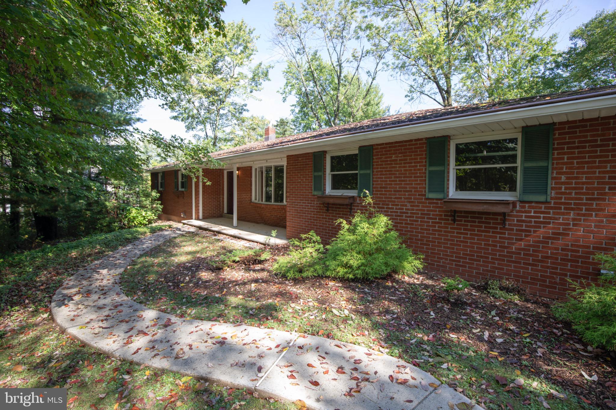 72 Heffner Road Royersford, PA 19468 - Photo 3 of 20 Charming brick home nestled in lush greenery.
