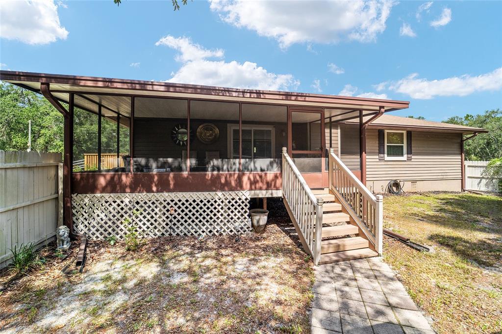 15755 Southwest 90th Avenue Dunnellon, FL 34432 - Photo 36 of 55 a front view of a house with a large window
