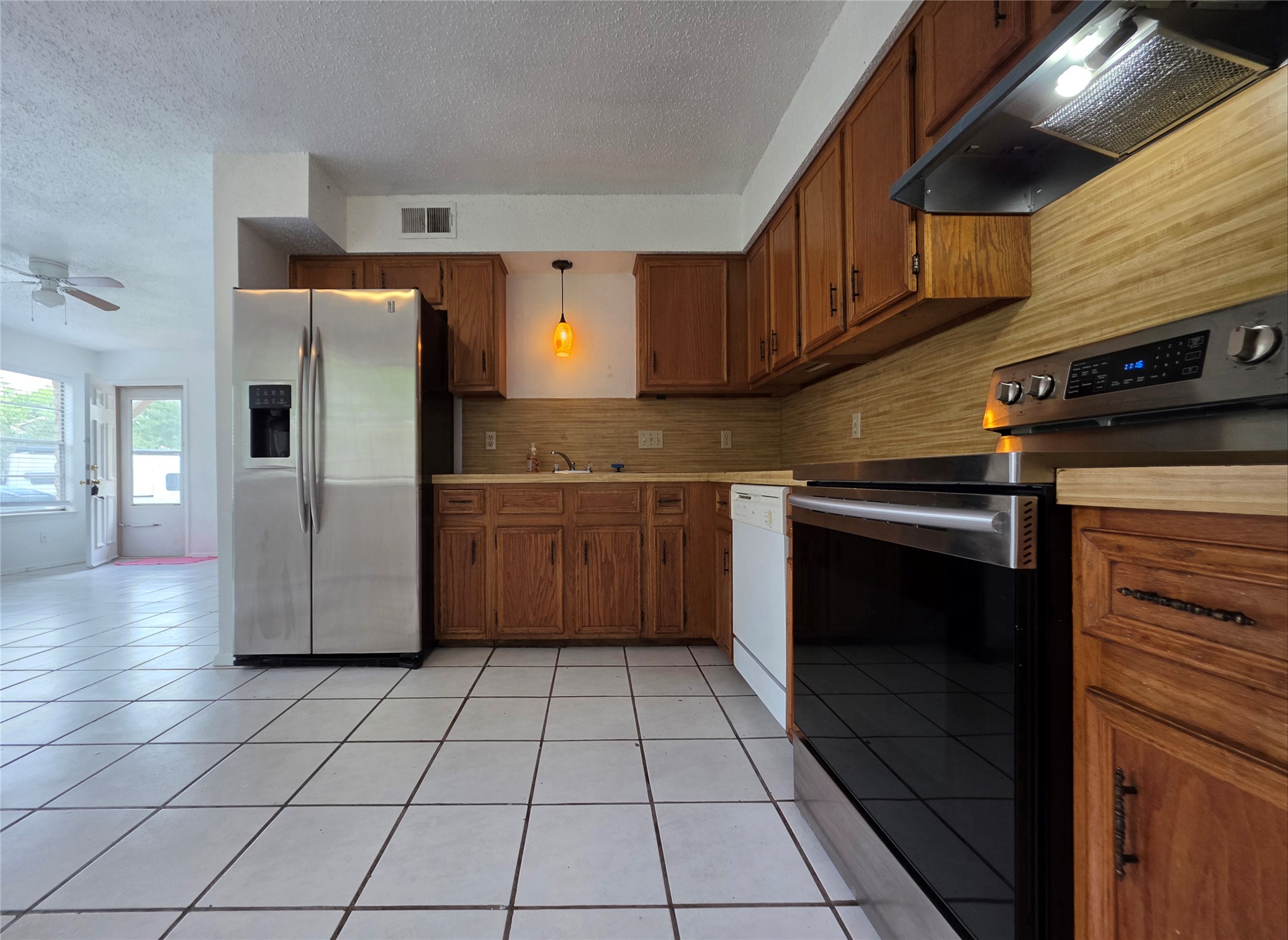 8818 Clearbrook Trail Austin, TX 78729 - Photo 9 of 22 Unit A Kitchen looking towards front door