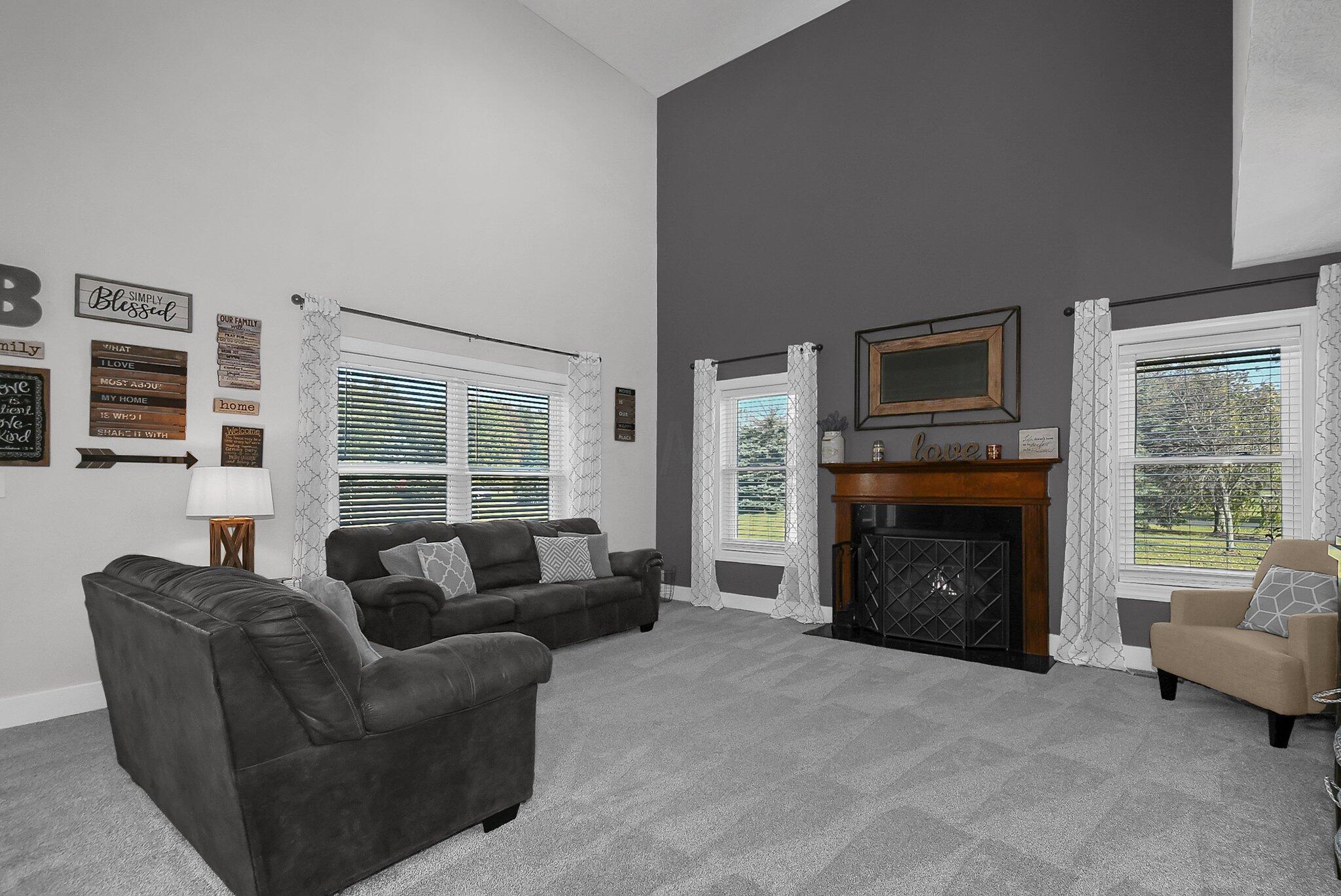 3620 Hyatts Road Powell, OH 43065 - Photo 12 of 54 Great room with 2 story ceiling. Light grey and medium grey walls with light grey carpet.