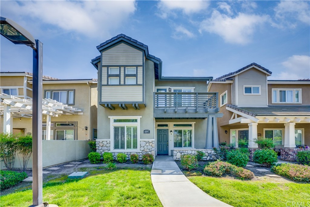 4987 Lindenwood Lane Riverside, CA 92504 - Photo 1 of 1 front view of a brick house with a yard