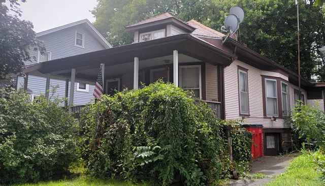 front view of a house with a garden
