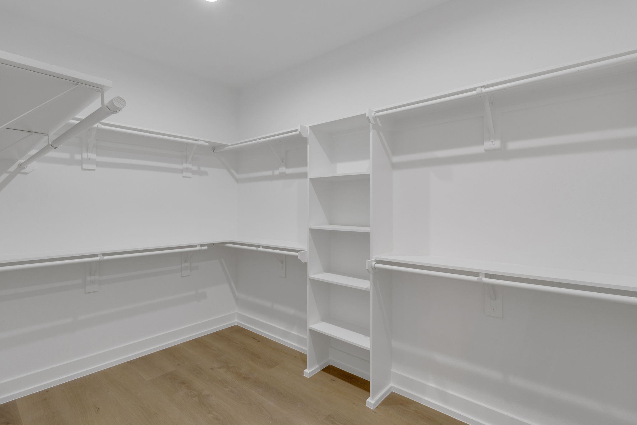 4202 Plaag Street Houston, TX 77016 - Photo 28 of 38 Generous walk-in closet with built-in shelving and ample hanging space.