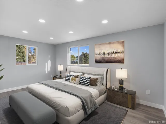 a bedroom with a bed and a night stand