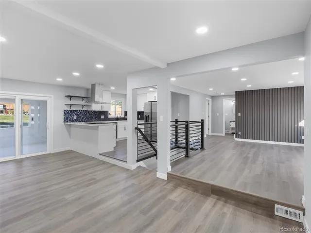 a view of kitchen with wooden floor