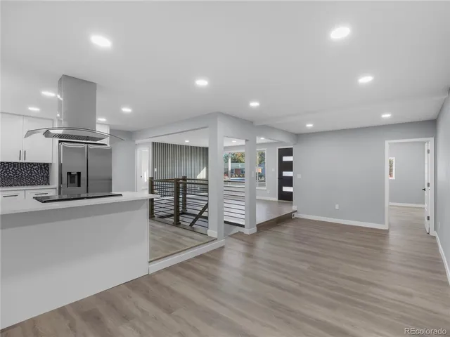 a view of kitchen with cabinets and wooden floor