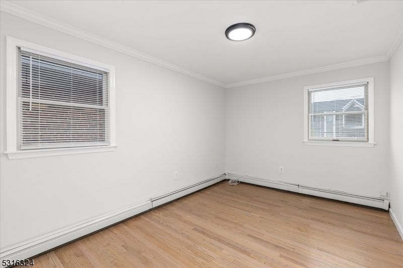 4 Coppola Street Nutley, NJ 07110 - Photo 12 of 14 an empty room with a window