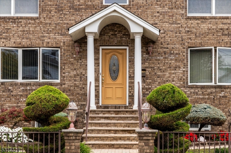 4 Coppola Street Nutley, NJ 07110 - Photo 2 of 14 a front view of a house with outdoor space