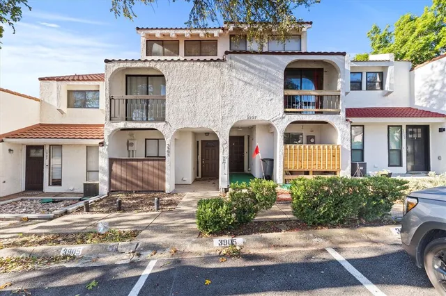 a front view of a house with yard