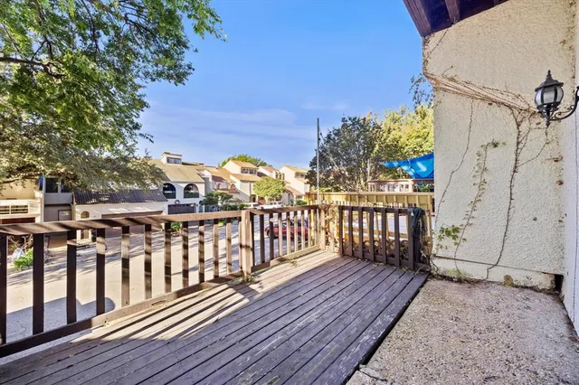 a view of a wooden deck with a patio