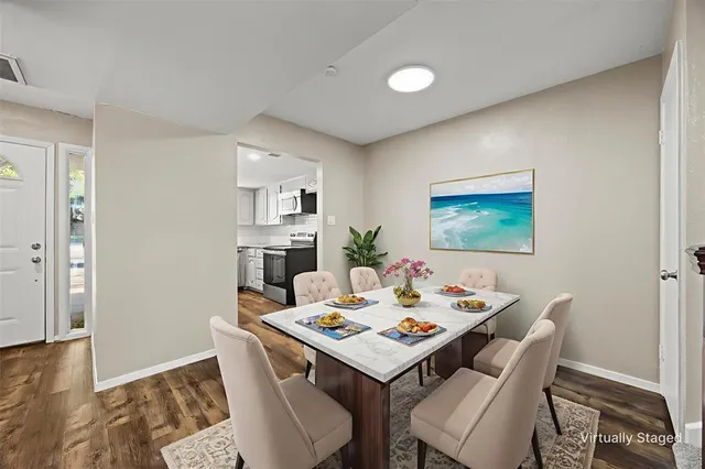 a view of a dining room with furniture