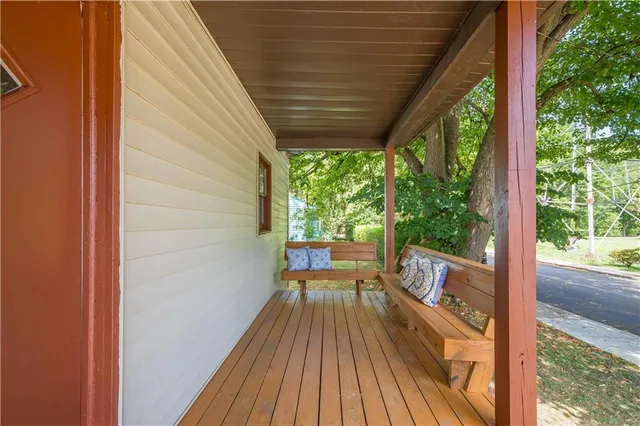 a view of balcony with wooden floor