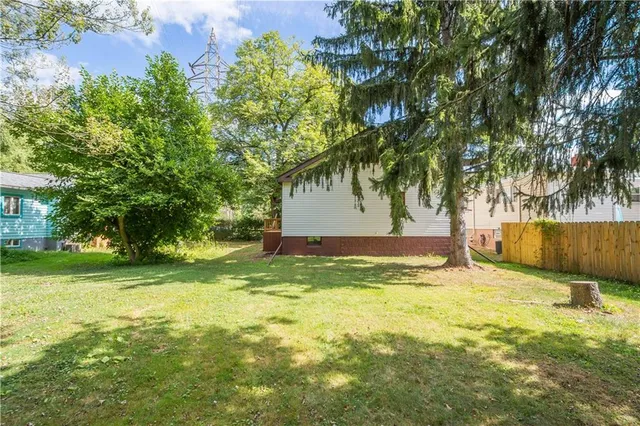 a view of a yard with a tree
