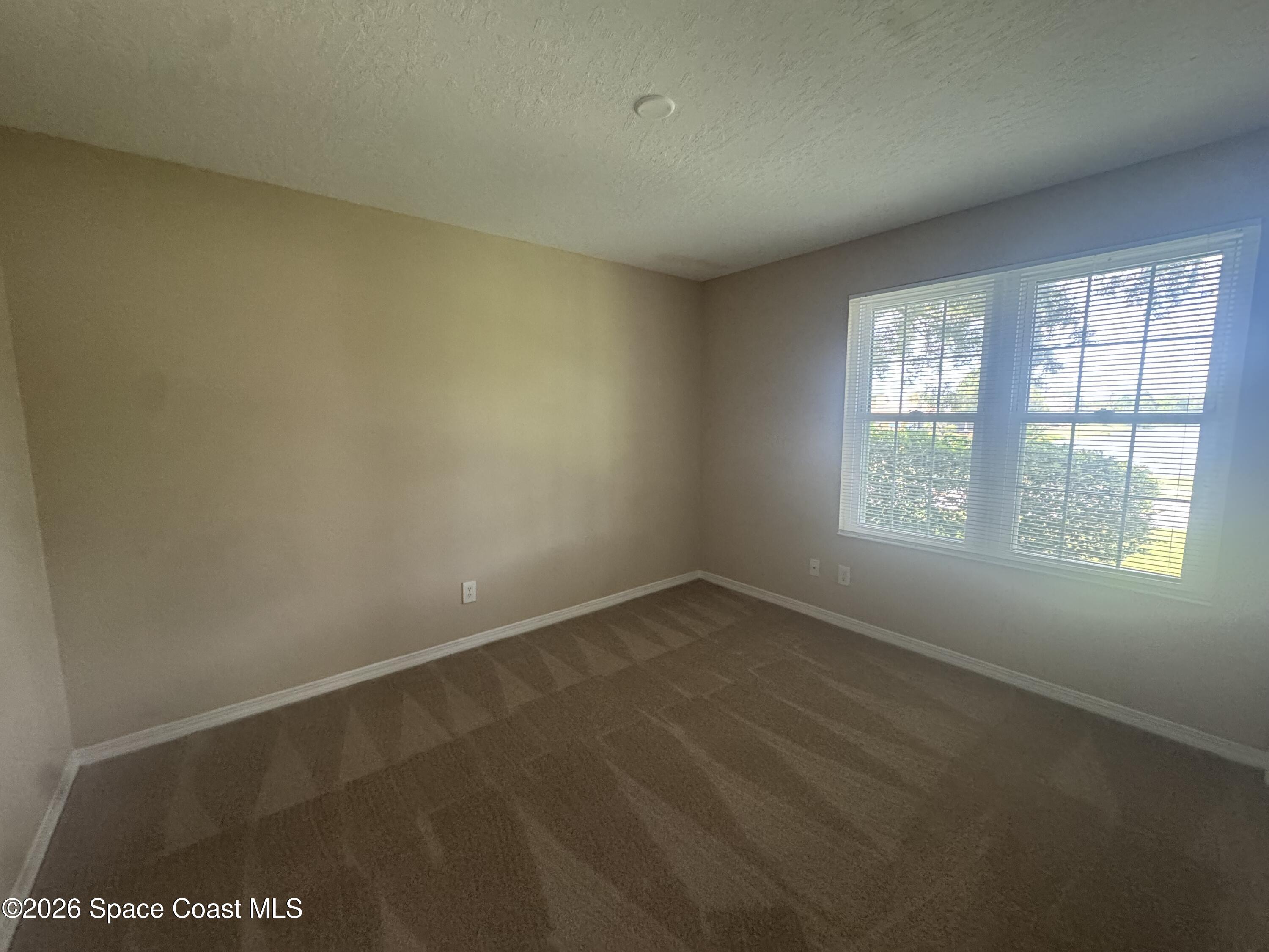 7667 North Wickham Road, Unit 1415 Melbourne, FL 32940 - Photo 9 of 23 Guest bedroom 3
