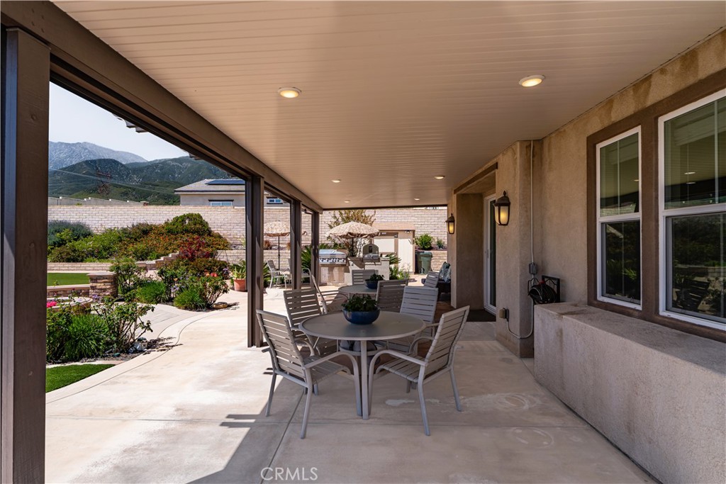 4976 Golden Ridge Place Rancho Cucamonga, CA 91739 - Photo 46 of 56 Large covered alumiwood patio cover with recessed lighting and automating drop down shades