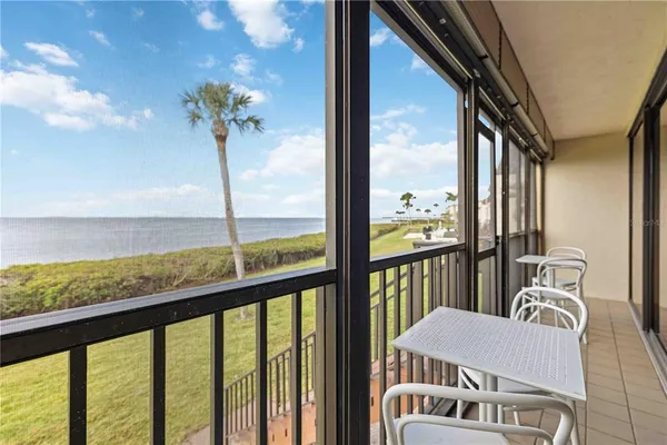 a view of a balcony with chairs