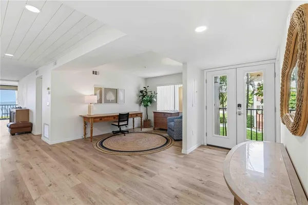 a living room with furniture a window and a table